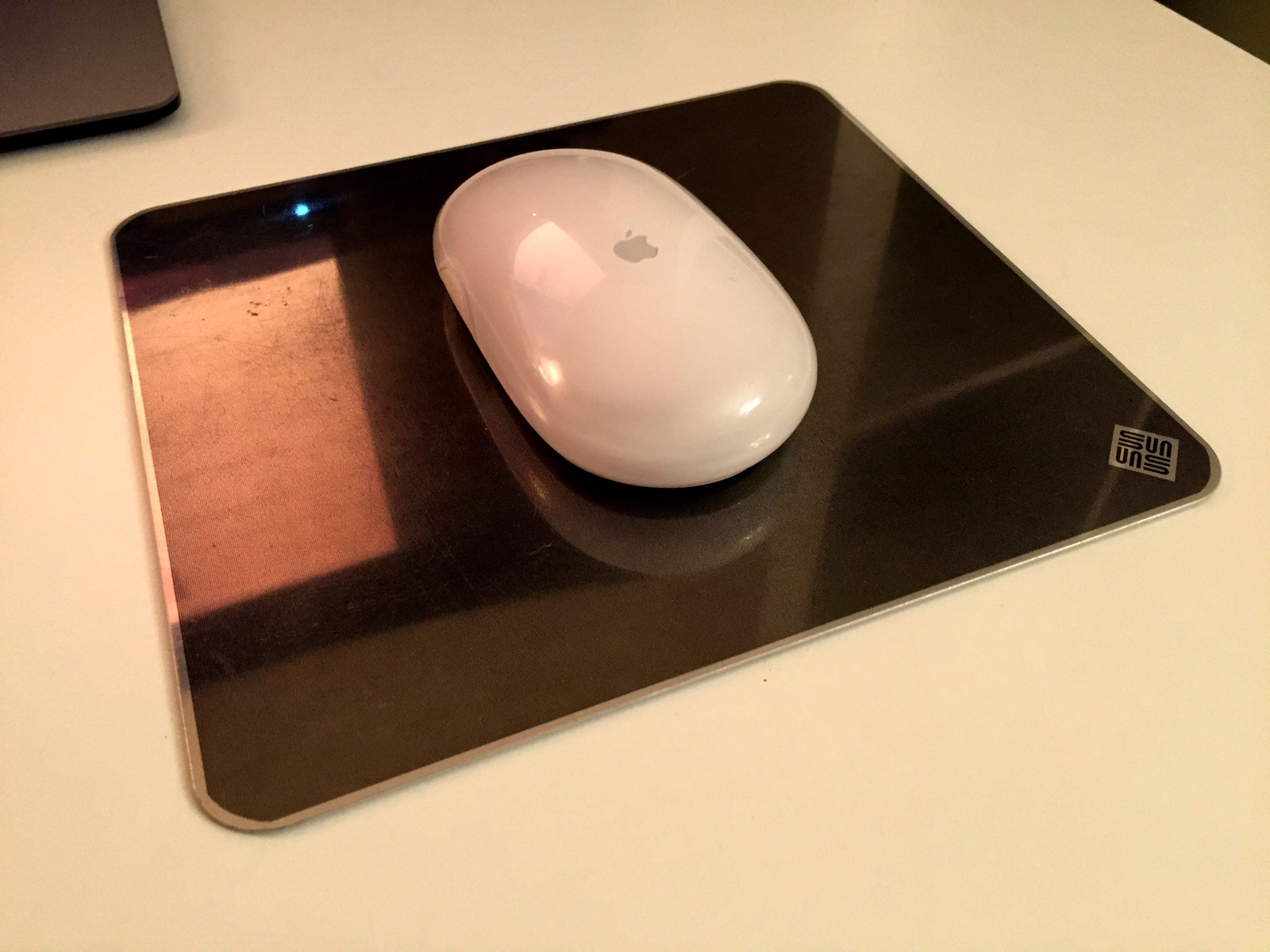 Apple wireless mouse on Sun microsystems metal mouse mat